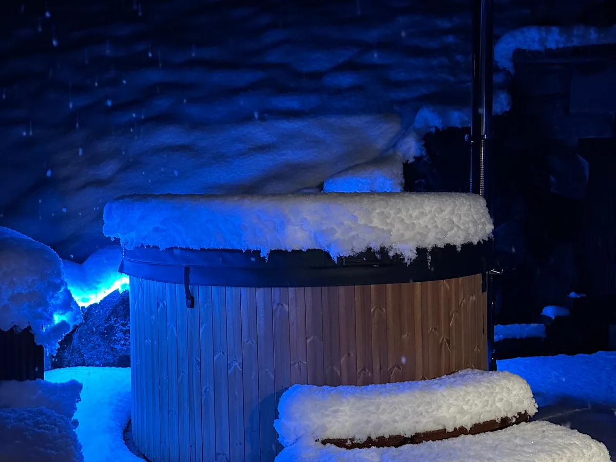 The Apartment at Chalet Staubbach with private wood-fired hot tub and waterfall view